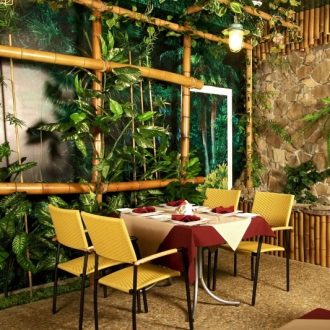 bamboo feature wall beside a dinner table