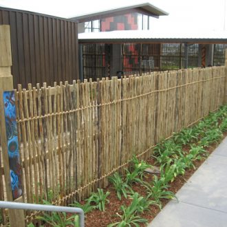 eucalyptus fencing outdoors around a building