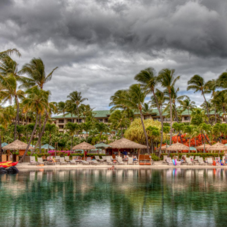 Thatch umbrellas at resort beach area